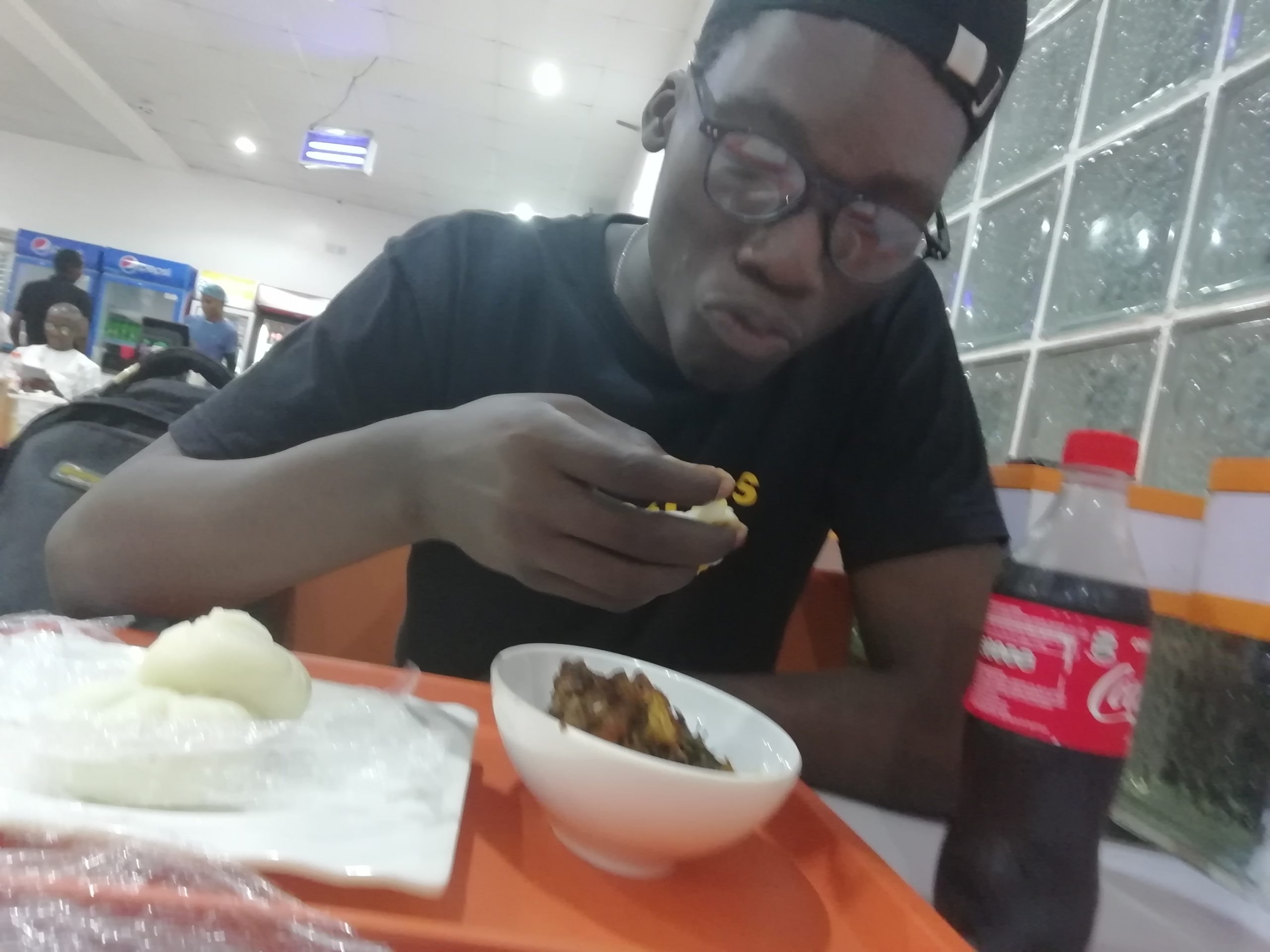 man eating pounded yam